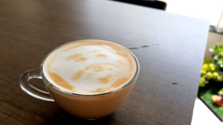 Two hands creating a heart and showing the sun